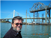 Ron enjoys the view of the new bridge and the old bridge as it is being disassembled.